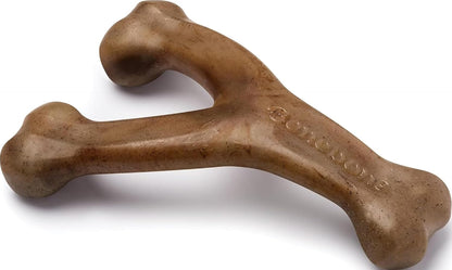 A brown rubber bone-shaped dog toy with a split design, photographed on a clean white background.