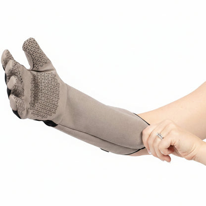Gray glove with textured palm, held by a hand, on a white background with text about glove features.