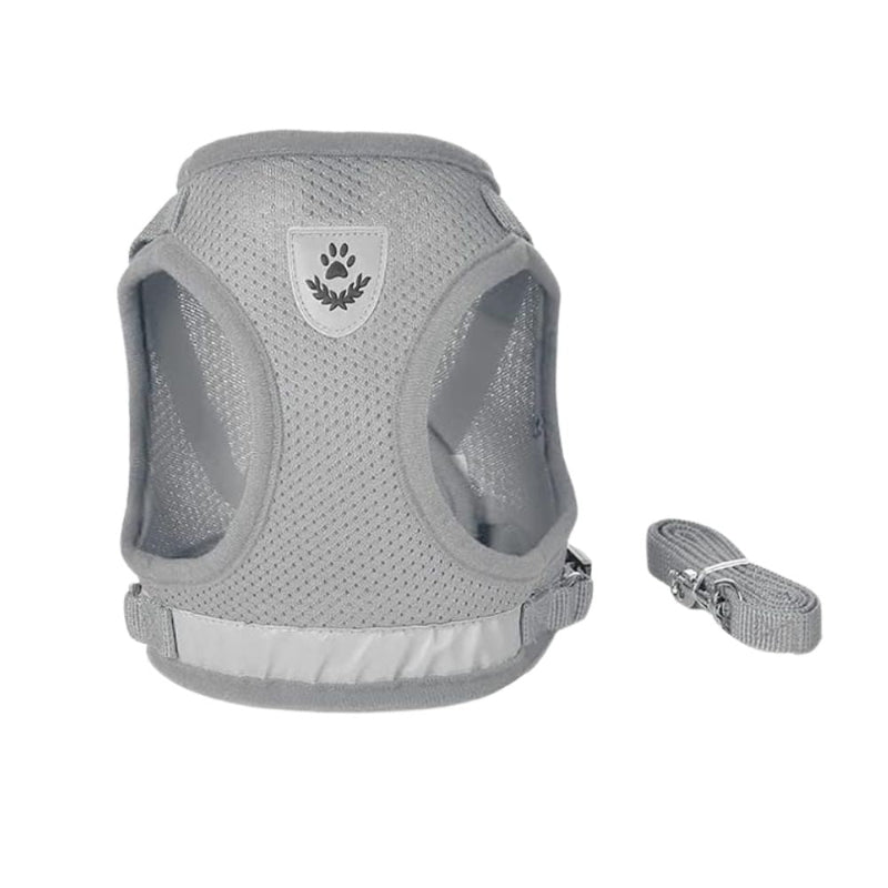 A light gray mesh dog harness with a matching adjustable strap, shown on a plain white background. The harness features a central shield-shaped patch with a dark gray paw print and leaf design.